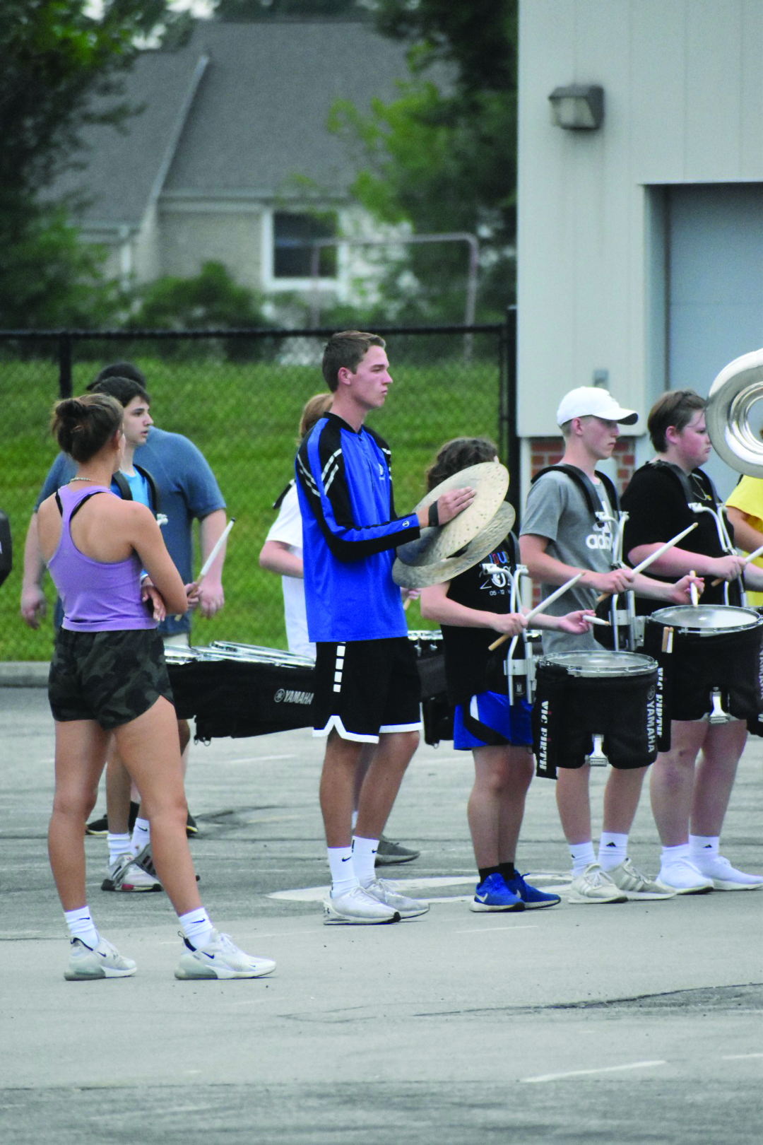 The percussion section of the marching band practices. Hannah Kobza, marching band member and senior, said a typical rehearsal is split into different sections multiple hours long, called blocks. 