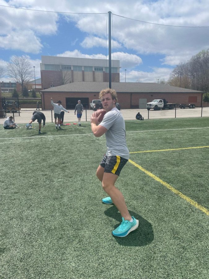 TOUCH DOWN: Hayden Cate, a senior at Carmel, looks down field during life time fitness class for an open teammate on Tuesday, April 26. Students get the opportunity to play and learn the rules to all different types of sports during life time fitness.