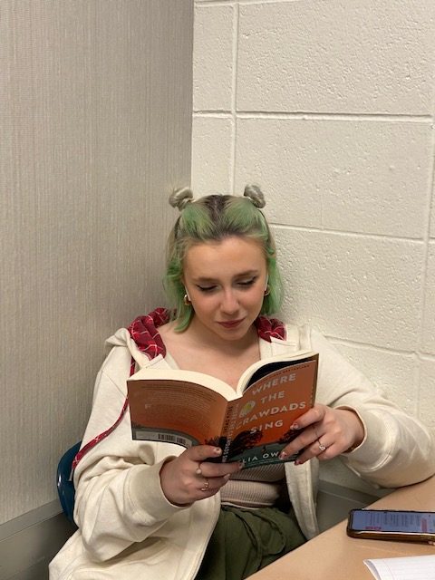On April 19, Olivia Jones (sophomore), uses some of her class time in Honors English 10 to catch up on her assigned reading. When asked about the book she is reading (pictured), Olivia stated “It’s called Where the Crawdads Sing and so far I’m only 30 pages in but it’s so good!”. Olivia is supposed to finish the book by early April.