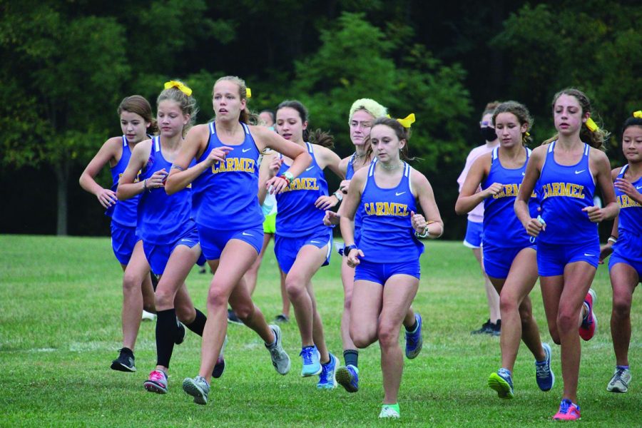 Members of the women’s cross-country team run in a race last fall. Taylor Marshall will serve as the team’s new coach for the upcoming 2021-22 season.
