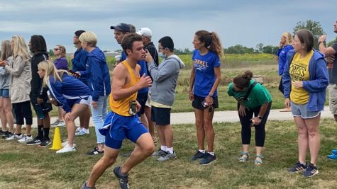 James Jay, cross country runner and junior, runs in the Zionsville preseason meet. Coach Altevogt said that the team is in a really good position to be a top team in the state this year.