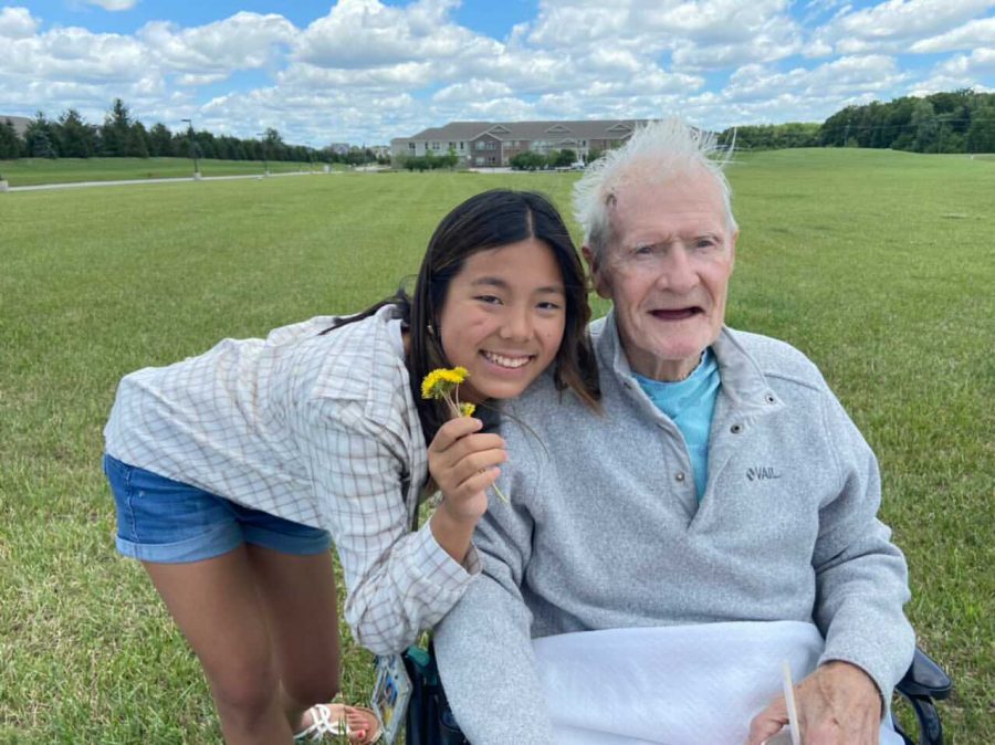 Junior Katie
O’Daniel
poses with her
grandfather
outside of their
home on the
yard. She said
she likes the
family aspect
and increased
time she gets to
spend as a family
because of his
presence.