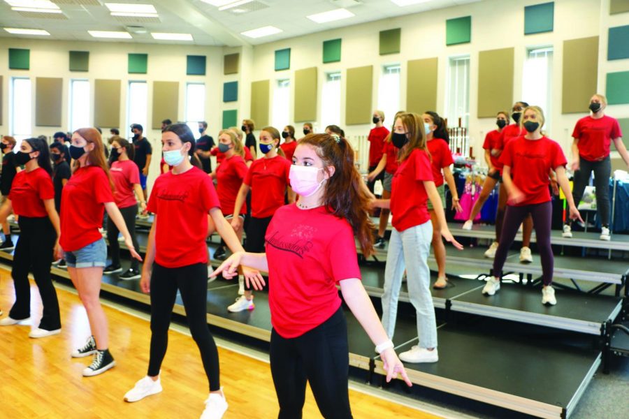 Creative Choreo: The Ambassador choir members practice their routines in a gym. The fall performance will be on Sept. 29.