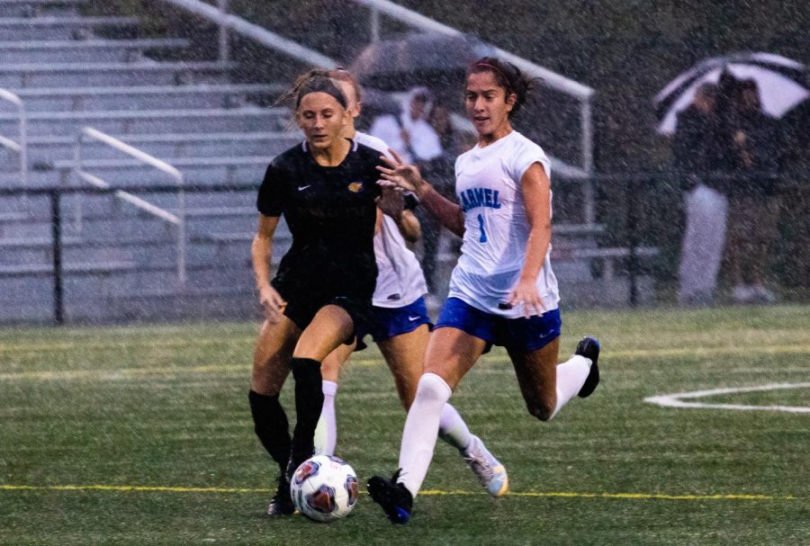 Luci+Bair%2C+varsity+women%E2%80%99s+soccer+player+and+senior%2C+dribbles+the+ball+in+a+Sectional+game+against+Guerin.+Bair+said+facing+higher+ranked+teams+drives+the+team+to+play+harder.