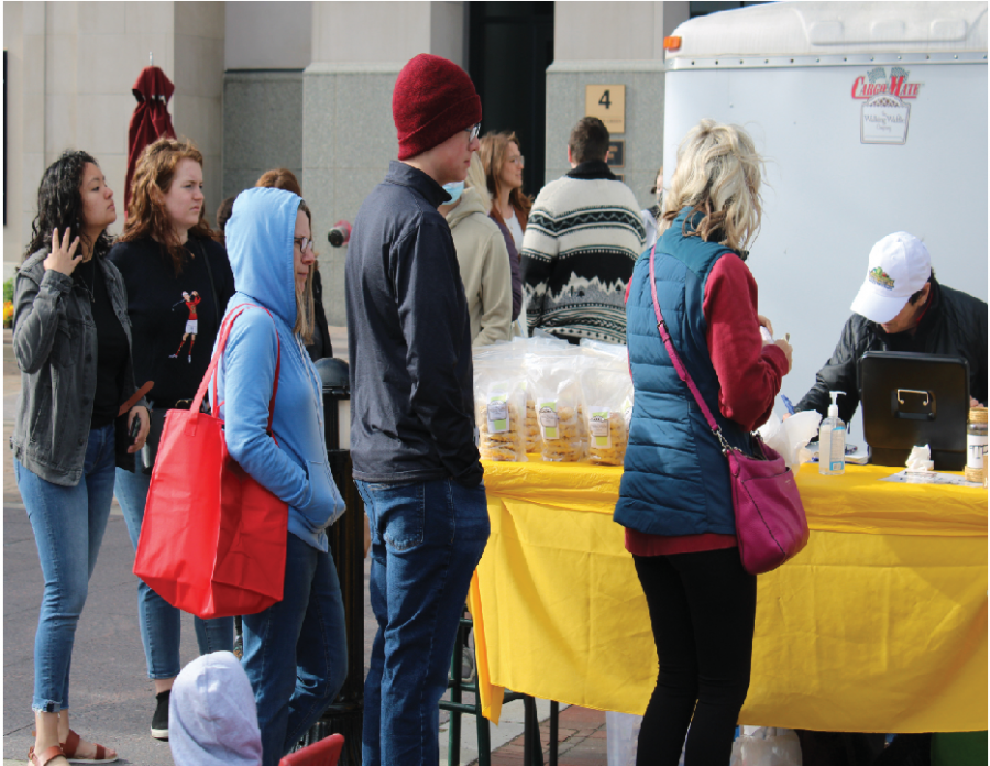  Customers of the Carmel Farmers Market stand in line to buy items. The market is open most Saturdays with the exception of Dec. 25 and Jan. 1 from 9 a.m to noon. Photo by Christian Ledbetter