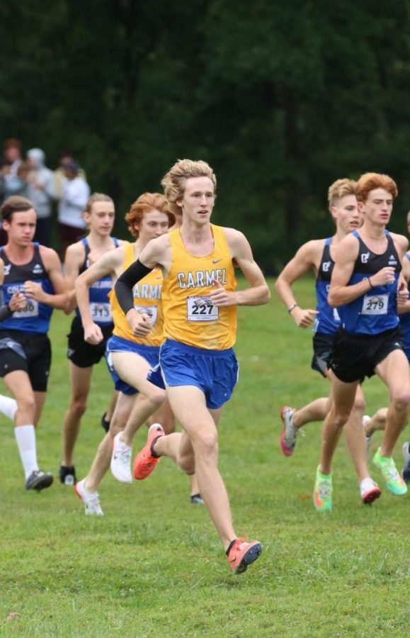 Kole Mathison, junior and varsity cross-country runner, runs in the Eagle Classic on Sept. 11. Mathison broke the school 5K record at the FlashRock Invite on Sept. 18 with a time of 14:52.1.