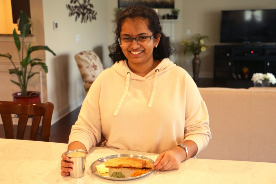 Senior Sneha
Srivasta poses
with traditional
Indian food
from her culture.
She says that
although she
has adapted to
the differences
in culture in the
United States, her
family still eats
traditional food
like dosa which is
an Indian bread
that has been
incorporated as
the United States
diversifies its
culture.