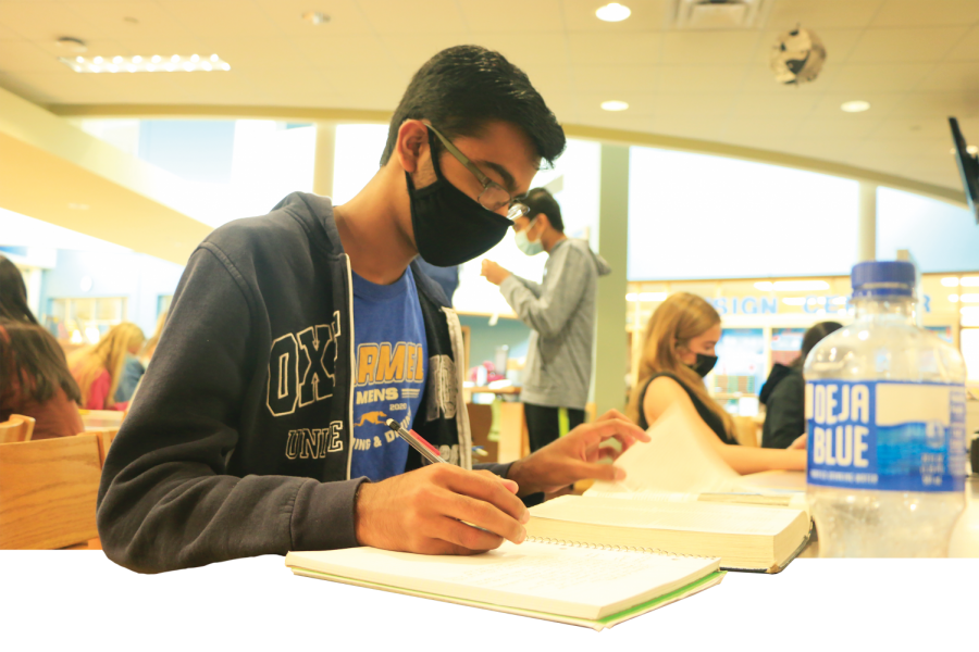  Junior Ishaan Singh studies for his AP US History class in the media center. Singh said he believes AP exams are too expensive and wished the state of Indiana would subsidize all AP exams. 
