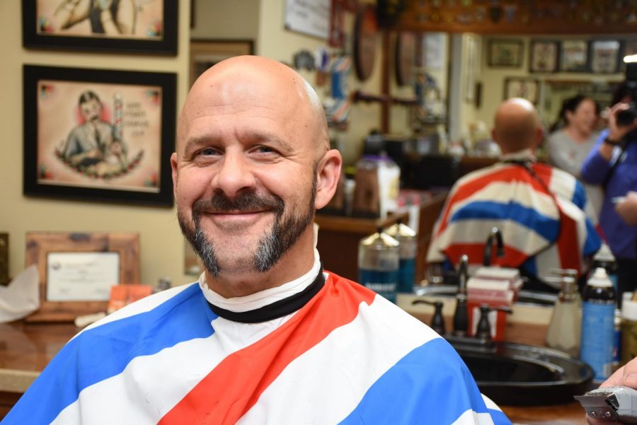 School Resource Officer (SRO) Shane VanNatter sits in a chair at the Main Street Barber Shop in downtown Carmel at the end of the 2020 No-Shave November events. VanNatter said officers from the Carmel Police Department participate in the “Shave Off” to help raise money for the Leukemia & Lymphoma Society. “We all go in that morning and they will shave (our beards) into patterns and stuff for us. Everybody has their photos taken and we try to raise some more money during the Shave Off, he said.