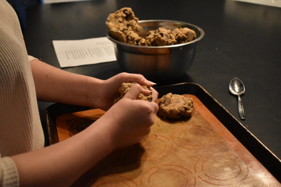 step two: To ensure the cookies bake evenly, Wright forms the dough into balls which she then places on a cookie sheet. 