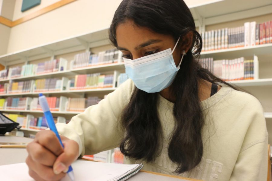 Sophomore Anin Nagajothi writes in the library during her free time. Nagajothi said, (Writing) was a nice way to get my mind off of things...Especially during quarantine, it was a great (way to pass time).”