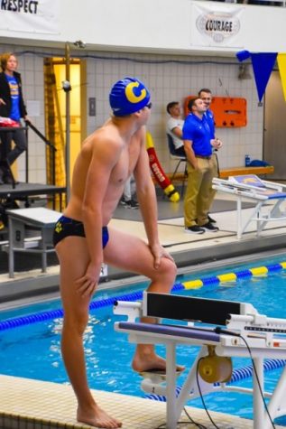 Ryan Roop, swimmer and junior, swims against Hamilton Southeastern High School in a meet. Coach Daly said that the team has a great chance to be a top contender for the State championship in early April.