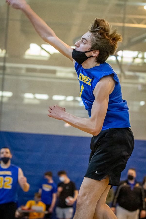 Ben Hastings, senior and volleyball player, jumps as he prepares to hit the ball in a game. Hastings said he thinks it’s a shame that not as many people know about men’s volleyball as other sports.