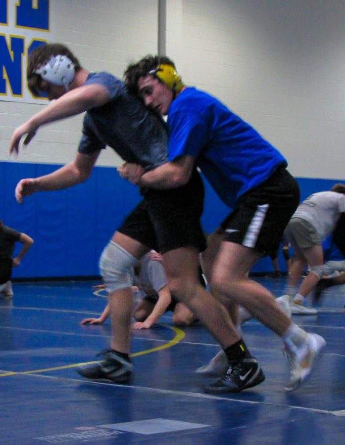 Wrestler and junior Nate Powell wrestles during practice. Powell said his teammates help him stay focused on his diet.