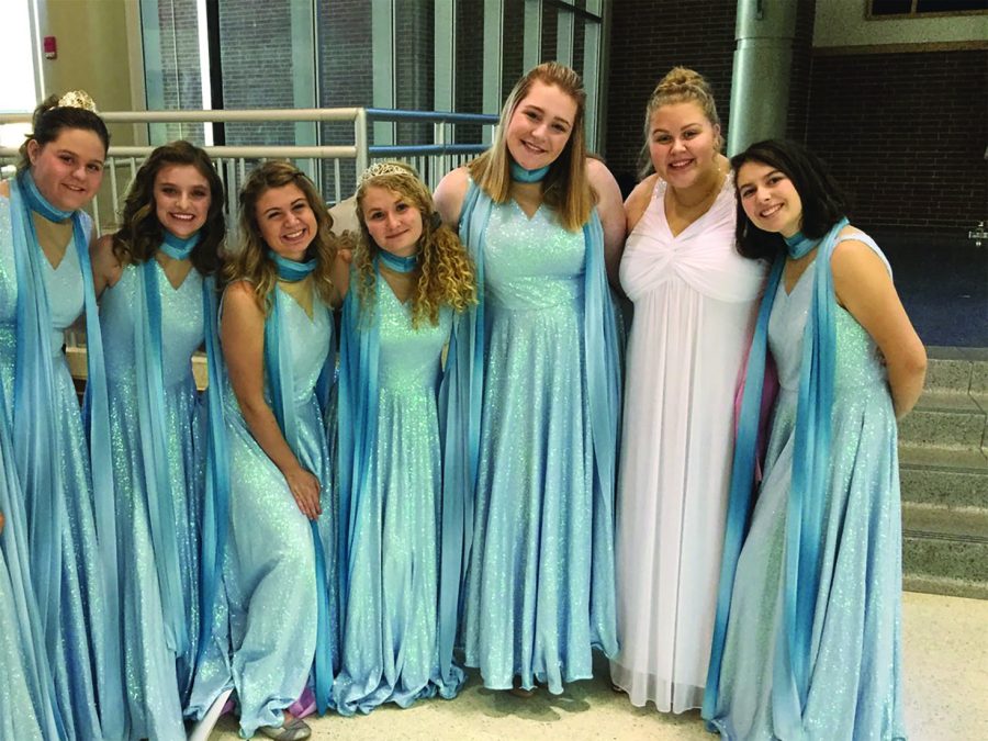 inspiring notes: 
Choir members pose during the Accents’ Princess Academy 2019. These members often inspire others to join the performing arts. Senior Erin Gordon (center) said she enjoys the choir community and participates in some of the choir workshops.