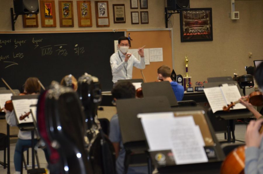 Director of Orchestras Thomas Chen conducts the Carmel Symphony Orchestra during after-school rehearsal. 
