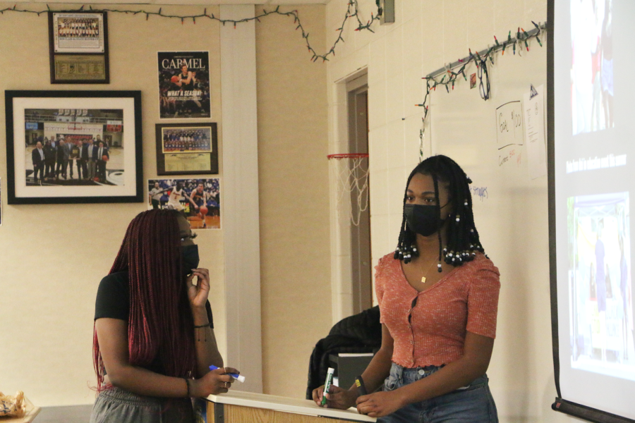 Juniors Vanessa Rasaki (left) and Kiah Jackson (right) discuss plans for Black History Month. 