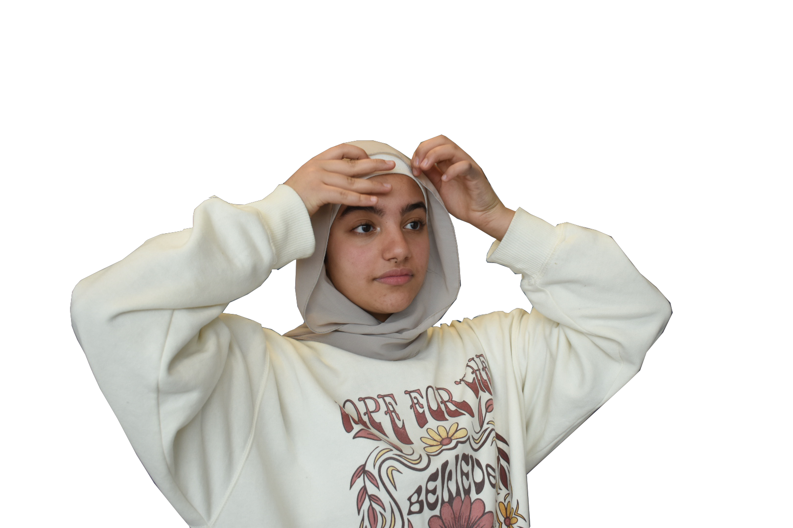 Freshman Mariam Morad fixes her hijab. Many women who practice Islam wear hijabs, but people choose to practice their religion in different 
ways.