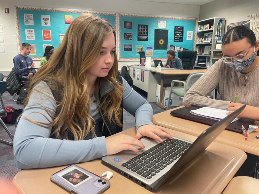 As she participates in the NHS peer tutoring sessions as a tutor, senior and NHS member Madeline Stacy works on an assignment. Students can get help from NHS peer tutors during SSRT in room E107. 