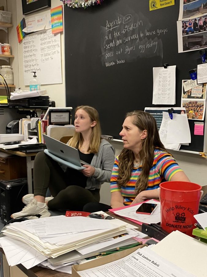 Head Coach Sarah Wolff (right) and Speaker of the House, Julia Muller look on as another student talks to them about student government. Wolff hosts student government in her SSRT classes during and after seasons.