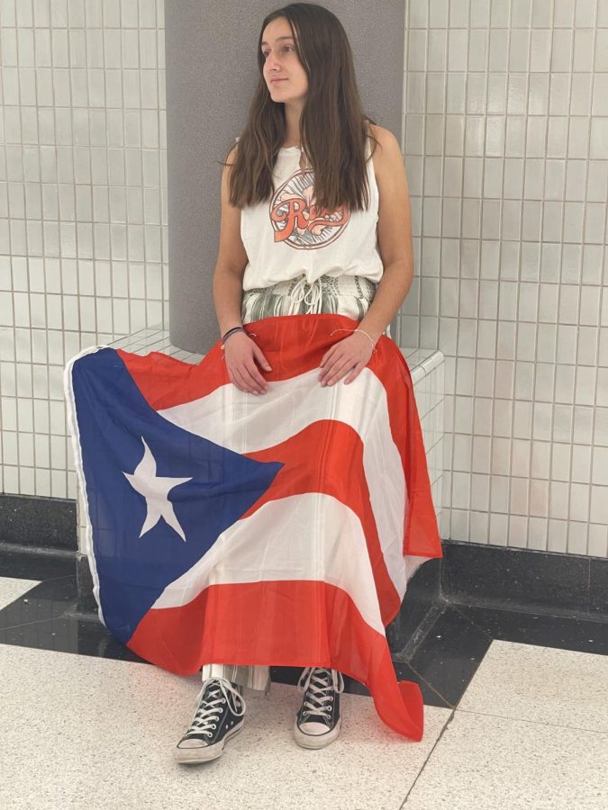 Freshman Paulina Arana Cervoni holds a Puerto Rican flag. Arana Cervoni said, in the past, she has been made to feel ashamed of her heritage, but she said she now feels proud to be Puerto Rican and to have the identity she does.