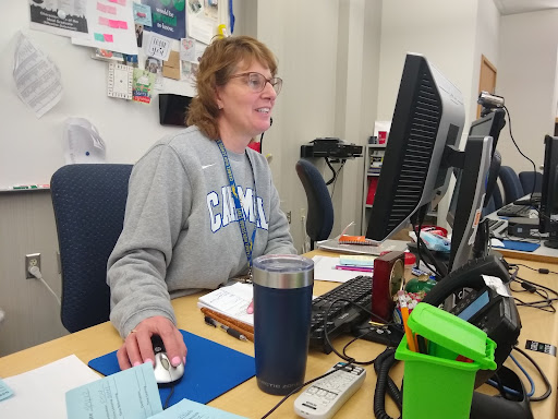 Carey Anderson, Green Action Club (GAC) sponsor, looks at the GAC meeting schedule and plans. Anderson said as CHS approaches the end of the school year, discussion surrounding the process of recycling and reusing school supplies will begin. 