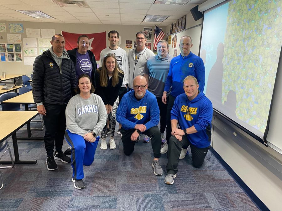 Physical education department staff prepare for their department meeting on March 23. They discussed the current curriculum, and how they can improve as a whole. “Hearing new ideas, and collaborating as a team is very important,” Ryan Osborn physical education department chair said.