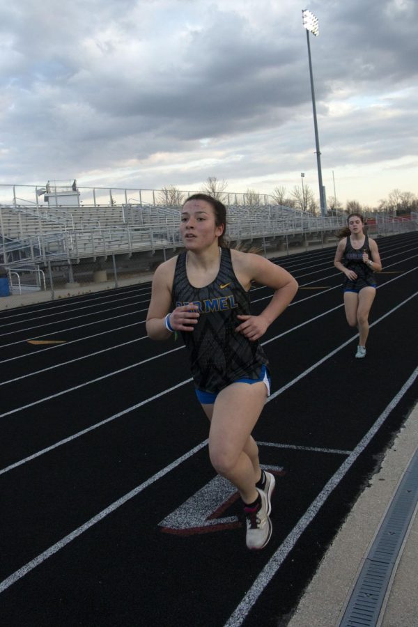 Lisa Venckus (LEFT), women’s track and field member and senior, runs during her race. Venckus should transgender athletes should be able to participate in the sport that matches their gender identity.
