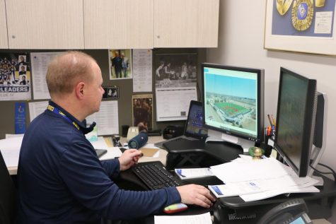 Athletics Director Jim Inskeep looks at the completed model of Hartman Field on March 28. Inskeep said it was time to bring the baseball complex up to the standards of other facilities here.