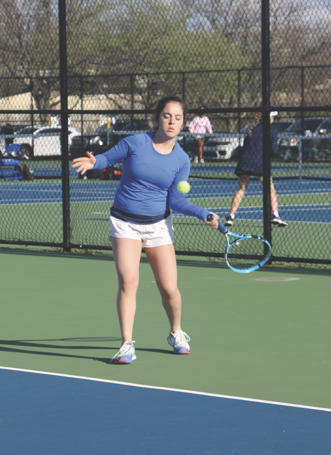 Emma Montarce, tennis player and sophomore,
warms up before a match.
Montarce said focus is essential to playing well in
tennis.