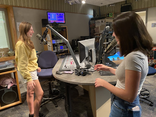 Caroline Houck, WHJE live shows manager and senior, works on a broadcast with Carley Field, WHJE decorations manager and senior. Houck said, “I love listening to music whether it’s on the radio or whatever and I also love talking which is why radio is perfect for me.”