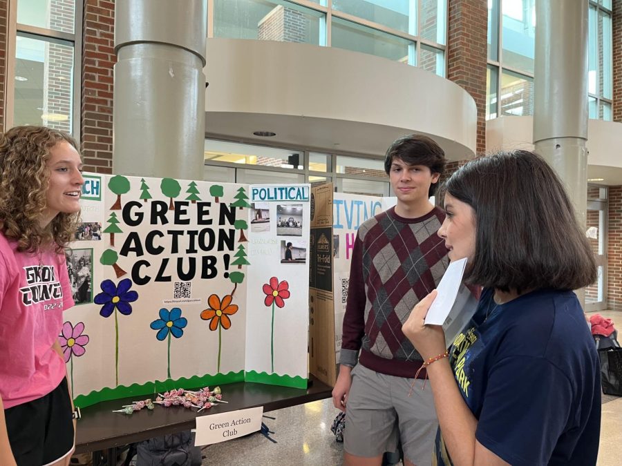 Jillian Moore (left) and Julien Doty (middle), Green Action Club (GAC) co-leaders and seniors, encourage freshmen at the CHS Club Fair in the freshman cafeteria to think about joining the GAC. Ella Lipnik, GAC co-leader and junior, who was also at this event, said the GAC is trying to get freshmen to join to help and involve themselves with the environment.