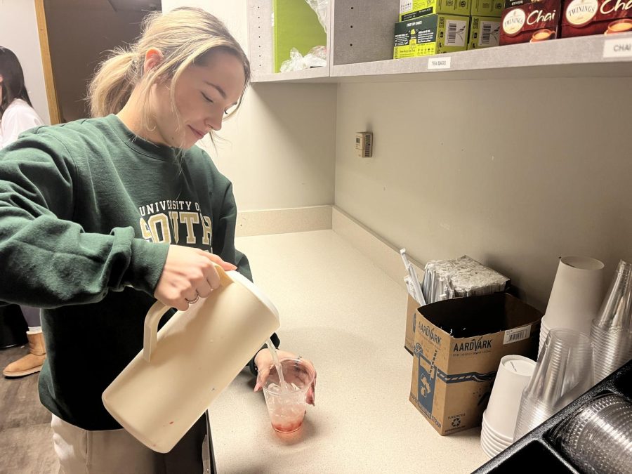 Senior Annika Lynch makes the new Frostbite Lemonade drink at the Carmel Cafe on January 25. The Cafe is open before school and during class times for students to order food and drinks. The Cafe also provides a nice space for students to socialize and study before class starts. 