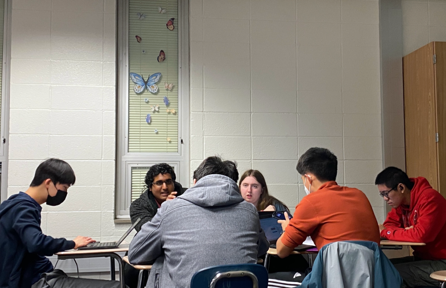 DATA COLLECTION: Students in Laura Moores AP Research class discuss data collection on Jan. 10. Students worked on presentations explaining their research progress and their future goals. Following data collection, the class will begin the literature review portion of their research.