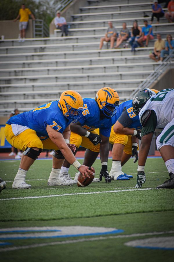 Carmel competes against Cass Technical on Sept. 2. Player and senior Jack Kazmierczak said the team works very well when they come together and build connections with each other.
