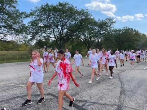 House of Representatives members and other participants walk to stations of the color run covered in paint and powder. House members will talk about more events like this one at their next meeting on Oct. 4.