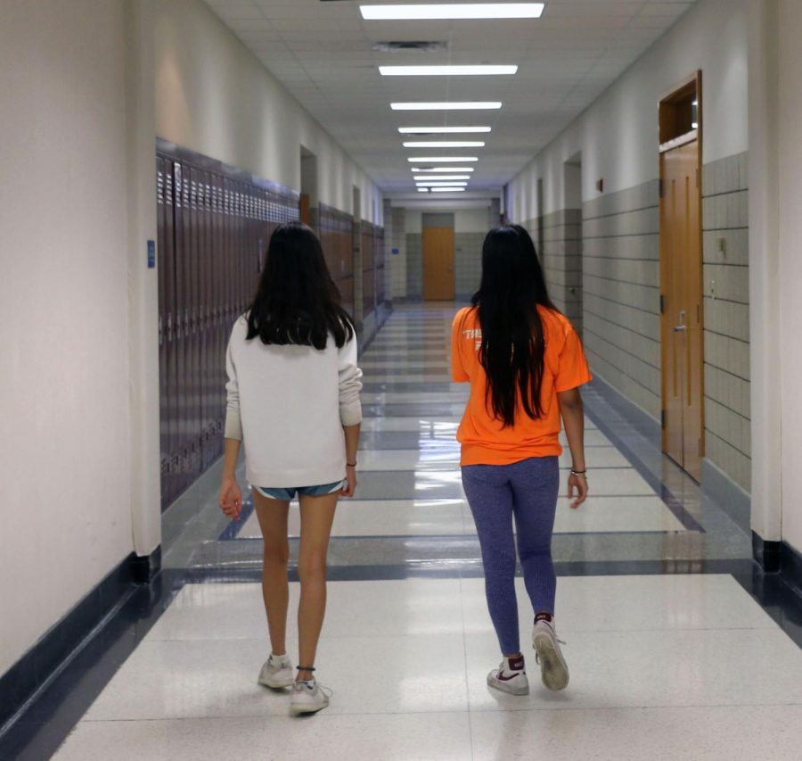 Junior Sehej Aurora gives a tour around the school to Freshman Naina Jakhar who is afraid of getting lost. Jahkar became more comfortable around the school, especially the freshman center after her tour with Aurora.
