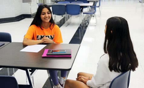 Junior Sehej Aurora talks to freshman, Naina Jakhar about the transition to high school. “GKOM program does a really good job of welcoming freshmen and ensuring that they’re comfortable in the new high school environment,” she said.