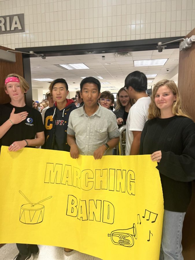 Band members and seniors Riley Stuelpe, George Huang, Landon Peterson, and Ahni Brown-Harbin lead the marching band section in the Walk Of Champions on Nov. 18. The Walk of Champions celebrated all the accomplishments of CHS clubs and other organizations at the school.