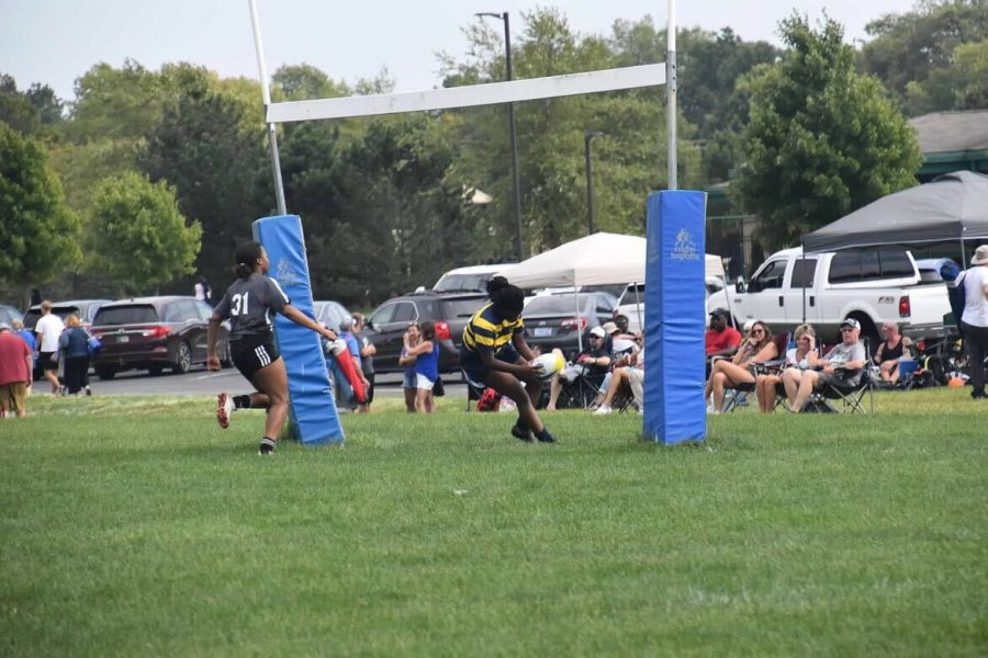 Sophomore Aissatou Diatta scores a try during a rugby game. Aissatou said she started playing rugby again because her brother played it and enjoyed it.