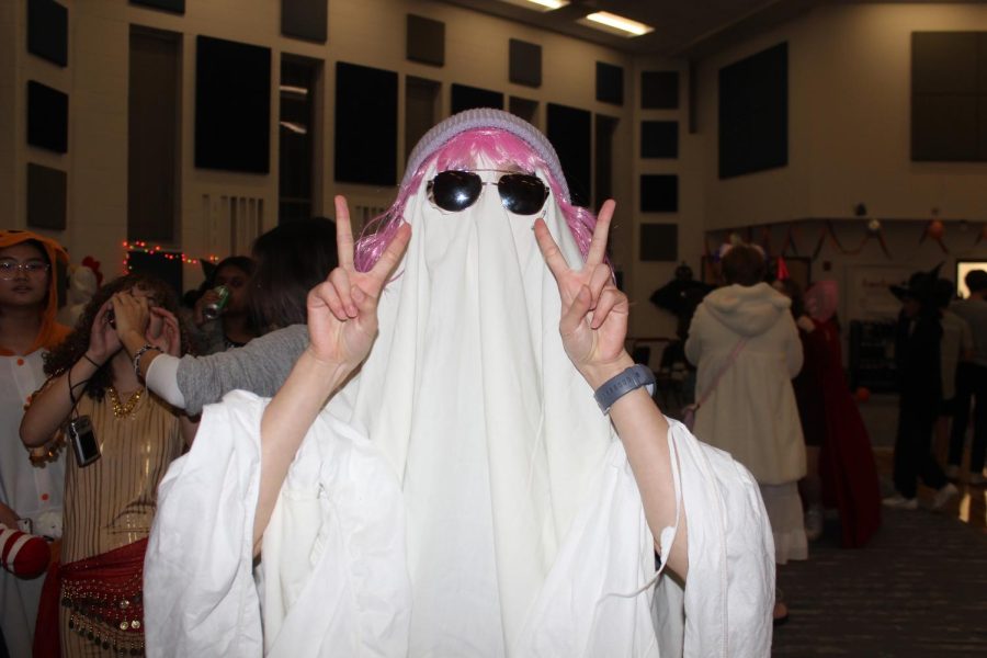 Sophomore Grace Nie dresses up as a ghost for the CHS Orchestra Halloween party. 
