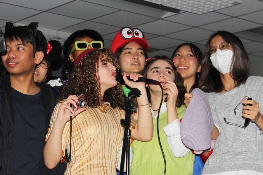 Members of CHS Orchestra perform karaoke during a Halloween party on Oct. 28. The party was planned by the CHS Orchestra Council. 
