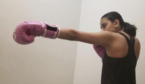 Aastha Sharma, boxer, demonstrates one of her stances. Sharma said she started boxing after getting inspiration from her father and brother.