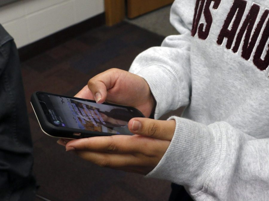 Sophomore Juhee Tyagi shows her friend a TikTok before class starts on October 5, 2022. Tyagi spends time on social media both before and during the class period.