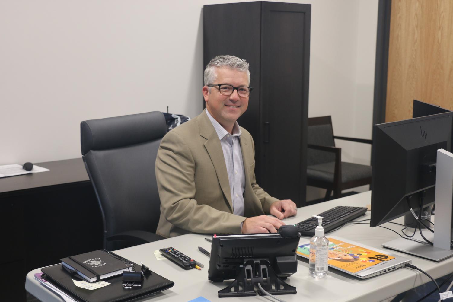 Principal Tim Phares works at his desk in his new office. Phares said he will visit Allen, Texas in February for another large-school consortium meeting.