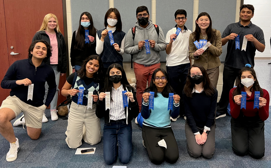 Sahanaa Nishkaran, Interdisciplinary captain and sophomore (bottom row, fourth to the right) holds up two ribbons. The Academic SuperBowl team’s first invitational this year will be hosted in the second semester. 
