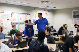 Adam Havice, health and wellness teacher, directs students with a partner activity. Havice said, “Hopefully, (the sex education curriculum) helps prevent intimate partner violence and helps young people develop healthy relationships of any kind.”