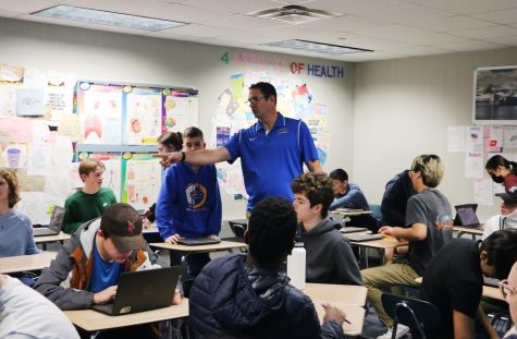 Adam Havice, health and wellness teacher, directs students with a partner activity. Havice said, “Hopefully, (the sex education curriculum) helps prevent intimate partner violence and helps young people develop healthy relationships of any kind.”
