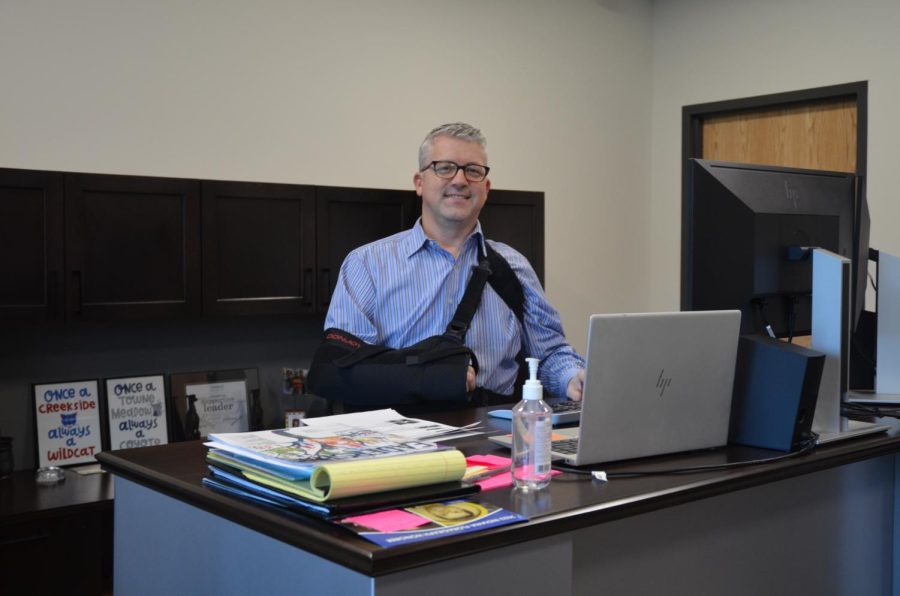 Principal+Tim+Phares+stands+at+his+new+desk.+Phares+said+the+school+is+working+to+increase+student+safety+and+efficiency.