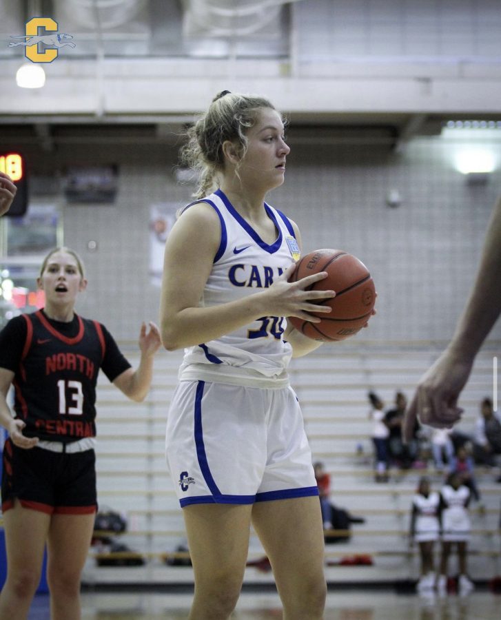 Photo from @carmelwbb instagram. Player and senior Hannah Lach competes against North Central High School on Dec. 16. Teammate and junior Jamie Elliot said her teammates help to encourage and motivate her during games.